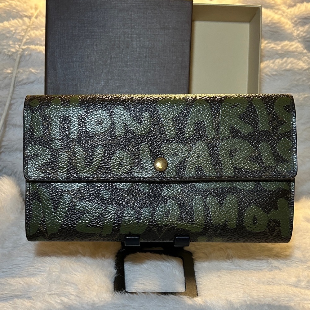 338. Louis Vuitton Limited Edition Monogram Graffiti Sarah Wallet,